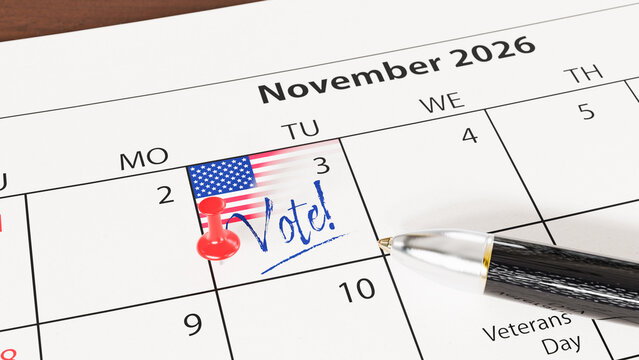 US midterm elections will take place on November 3, 2026. A calendar with a US flag, a thumbtack / pin and the text "Vote!" at the 3th of November. A pen lying on the calendar sheet. Web banner format