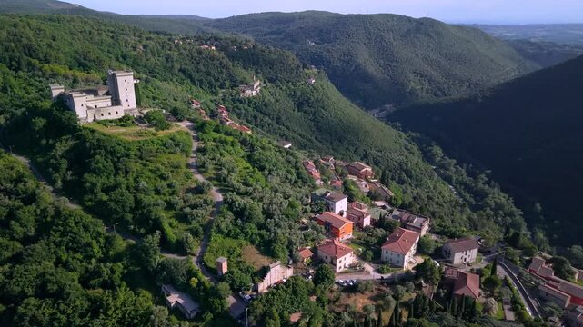 Narni Castle Umbria Italy 4K Aerial. Drone 70mm backward retreat from medieval fortress revealing historic hilltop borgo townscape during golden hour sunset. Beautiful villages hidden gems asset