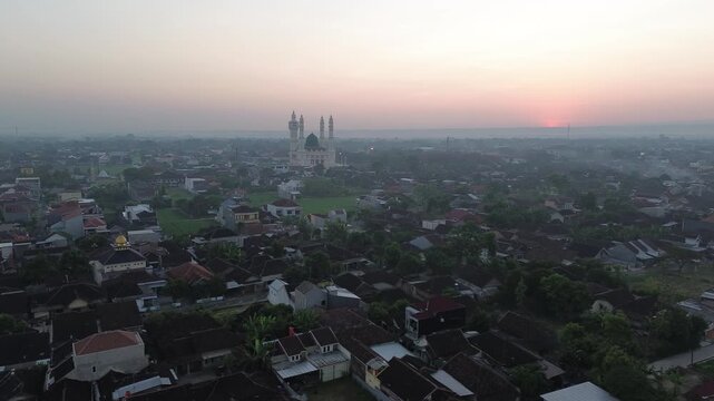 Aerial Sunrise View of Madaniyah Mosque and Mount Lawu in Karanganyar, Central Java, Indonesia