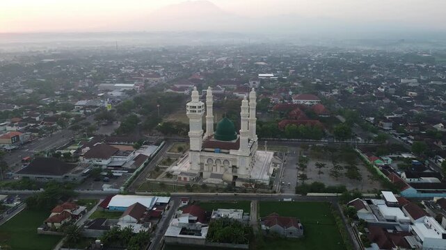 Aerial Sunrise View of Madaniyah Mosque and Mount Lawu in Karanganyar, Central Java, Indonesia
