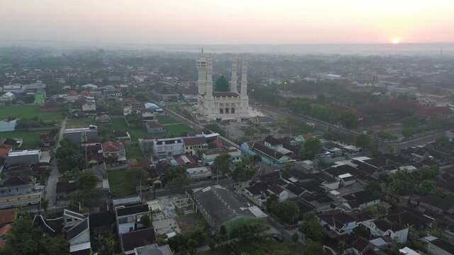 Aerial Sunrise View of Madaniyah Mosque and Mount Lawu in Karanganyar, Central Java, Indonesia