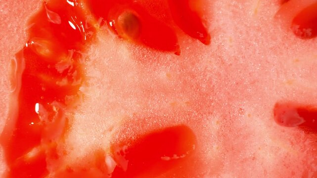 Fresh tomato texture photographed at extreme close range, emphasizing vibrant color, juicy interior, and organic quality. Great for nutrition campaigns, recipe backgrounds, healthy lifestyle concepts.