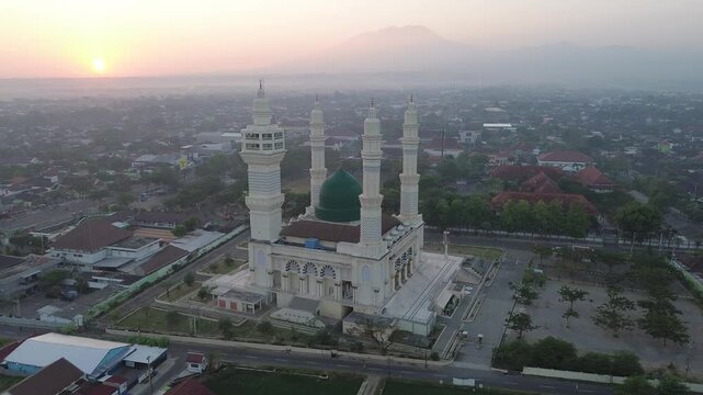 Aerial Sunrise View of Madaniyah Mosque and Mount Lawu in Karanganyar, Central Java, Indonesia