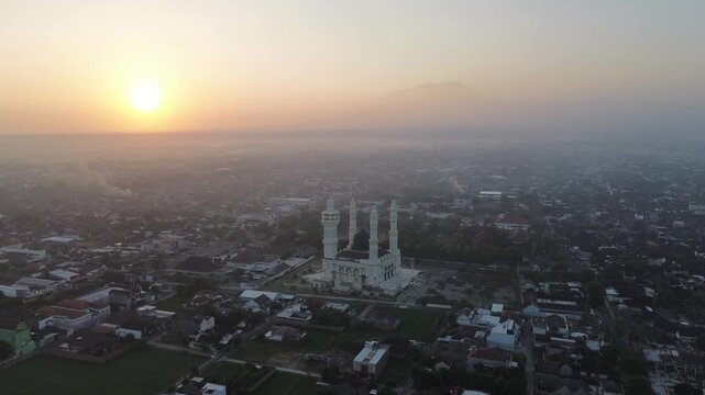 Aerial Sunrise View of Madaniyah Mosque and Mount Lawu in Karanganyar, Central Java, Indonesia