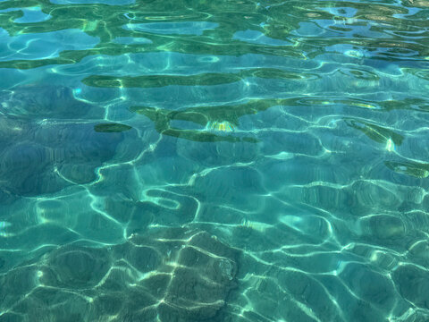 Amazing sea water turquoise clear surface with ripples.