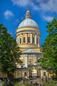 Holy Trinity Cathedral in Alexander Nevsky Lavra, St Petersburg, Russia. Classicism stone church, view from cemetery