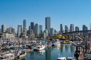 Fototapeta premium Vancouver Skyline and Marina with False Creek Waterfront and Modern High-Rise Buildings on a Sunny Day, British Columbia, Canada