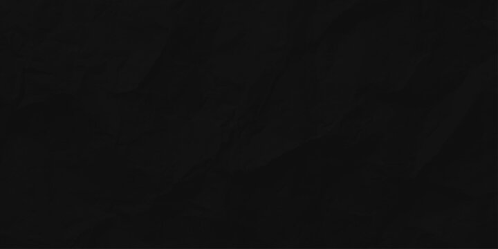 Black crumpled paper texture background with subtle creases and realistic dark rough surface for design backgrounds. A high quality, seamless dark black crumpled paper texture.