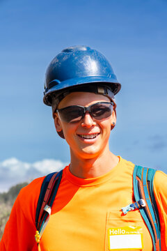 portrait of smiling construction worker, hard hat, safety gear