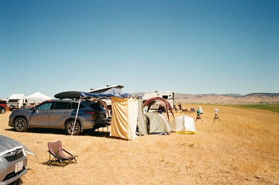 film car camping rv in field festival campsite 