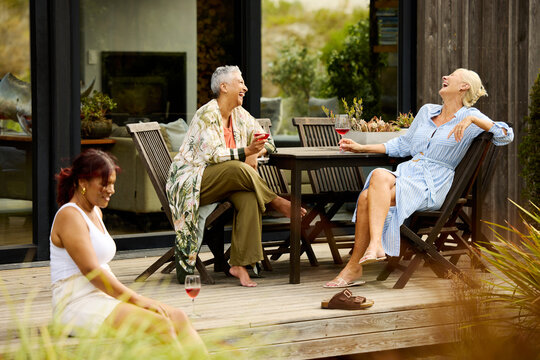 Friends Enjoy Time Outdoors at a Rental House