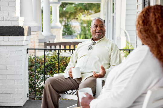 Couple Chats on the Porch