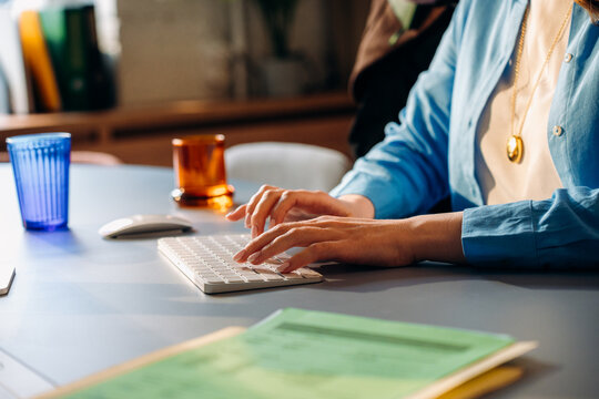 A woman uses a computer in the office