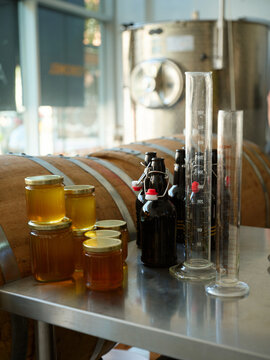 Bottles and jars of honey and beer in a brewery setting