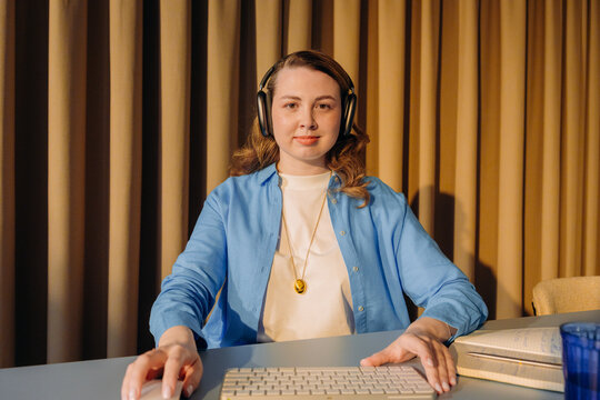 A woman is talking on a video chat in the office