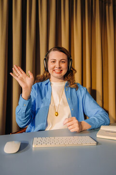 A woman is talking on a video chat in the office