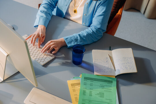 A woman uses a computer in the office