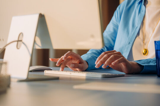 A woman uses a computer in the office