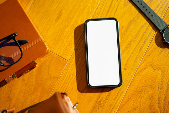 Smartphone is placed on a wooden table