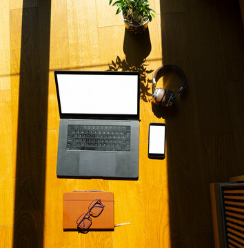 Working at home on a laptop and smartphone