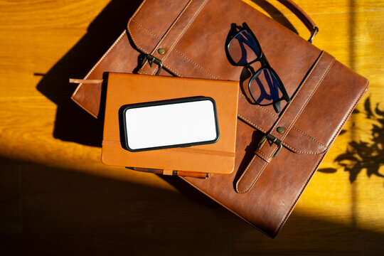 Items on a wooden surface with sunlight shining