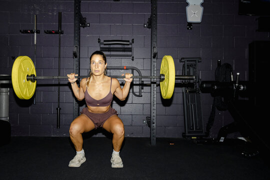 Barbell squat in functional gym training