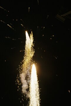 Twin Firework Fountains Exploding Against Black Night Background