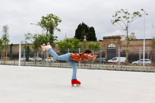 Skater Performs a Trick on Roller Skates 