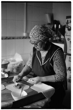 Senior woman preparing traditional empanadas
