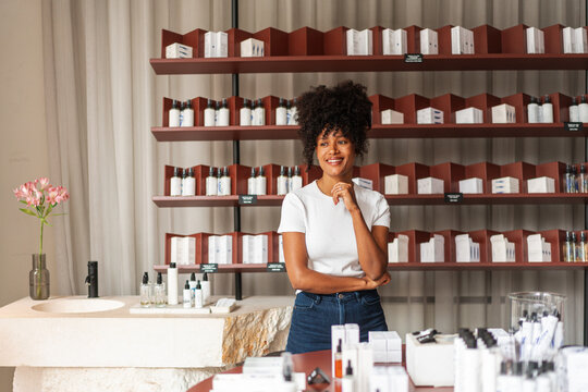 Smiling Beauty Shop Owner Standing in Skincare Store 