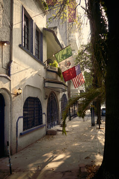 Street view with flags in a city during daytime