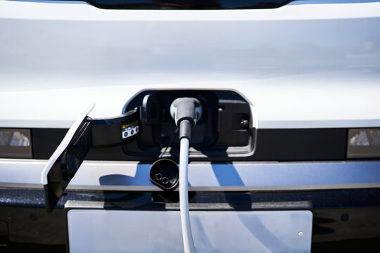 Electric vehicle port receiving power from charging cable