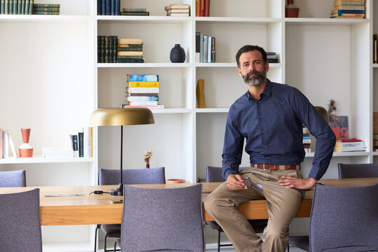 Portrait of elegant and Confident Businessman in Office