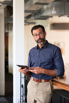Businessman in Office With Tablet