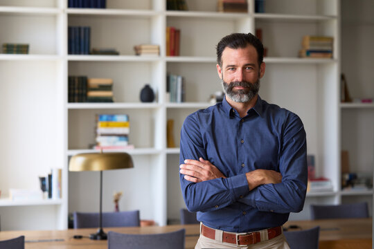 Portrait of Confident businessman with arms crossed in an office