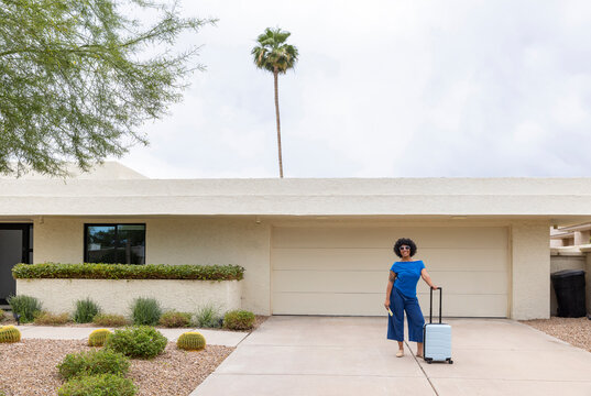 Black girl travel outdoors smile cell phone driveway home 