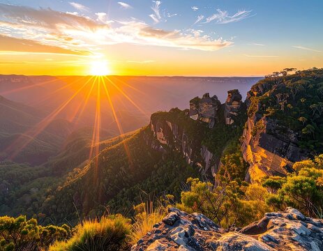 Golden sunrise illuminates a majestic mountain range with iconic rock formations and lush green valleys.