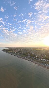 9:16 Vertical 4K Drone Aerial: Old Felixstowe Seafront and Shingle Beach at Sunset