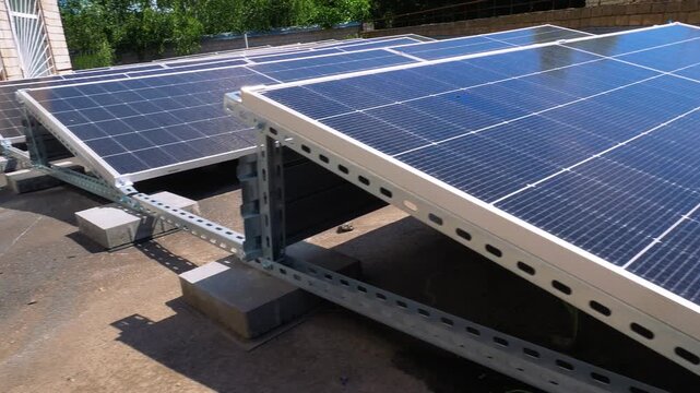 The Concept of Green Energy in an Urban Environment. Solar panels on the roofs of old apartment buildings. A rooftop solar power plant - Video set.