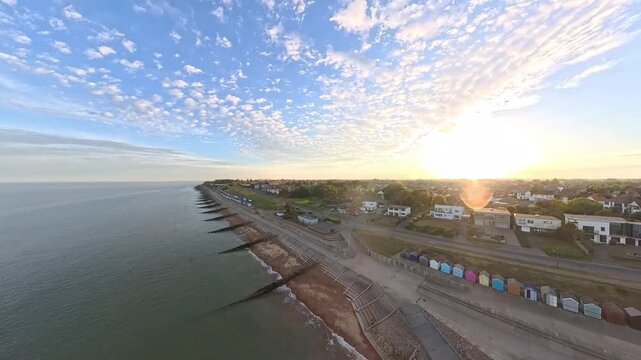 4K Drone Aerial View: Old Felixstowe Seafront and Shingle Beach at Golden Hour