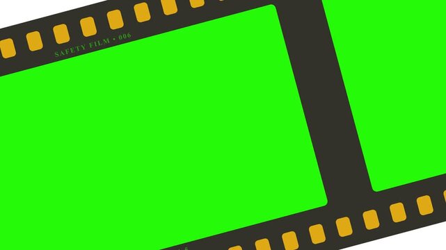 Film strip diagonal scrolling motion graphic with green screen chroma key frames and sprocket holes for cinematic overlay video transitions.