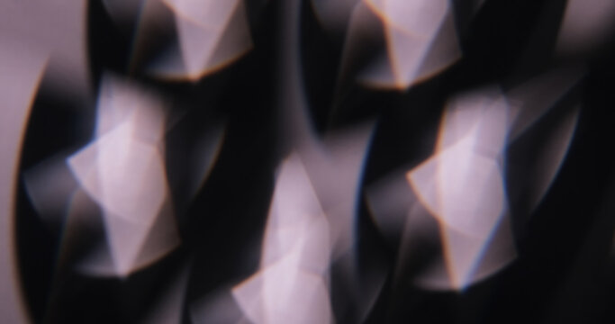 Defocused abstract flare. Glare art. Blur dark black purple illuminated glint lens leaking on dazzle optical creative art background.