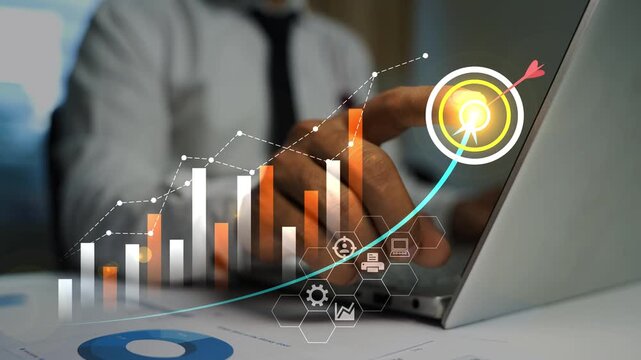 Businessman using a laptop with hologram digital charts and growth icons  , Business growth chart and data analysis on laptop