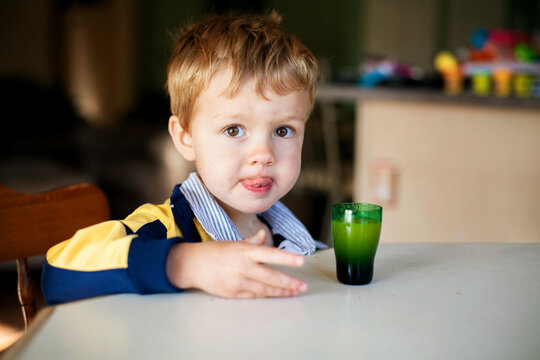 Boy at Table with Juice