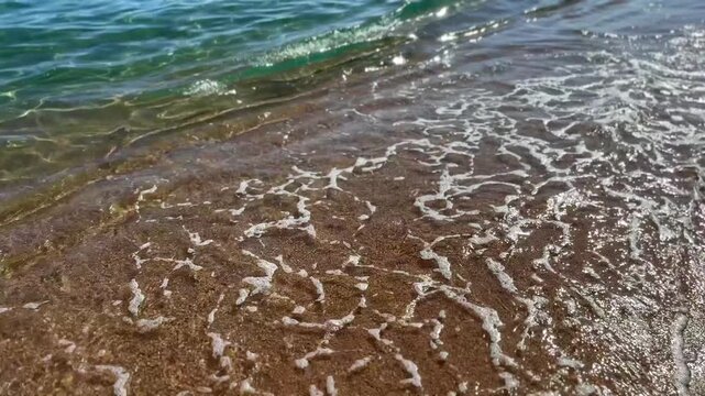 Beautiful sea side, summer beach, blinking lights in water, waves. Beach, coast line, Nature. Ocean Landscape background, vacation, travel concept 