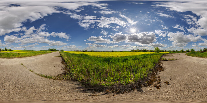 hdri 360 panorama near asphalt road and rapeseed fields in equirectangular full seamless spherical projection, for VR AR virtual reality content