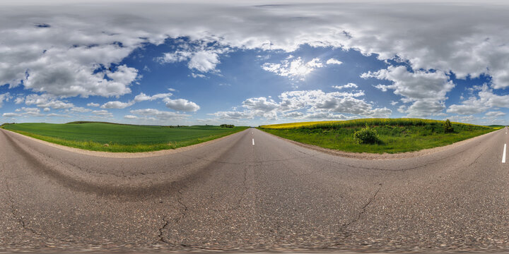 hdri 360 panorama near asphalt road and rapeseed fields in equirectangular full seamless spherical projection, for VR AR virtual reality content