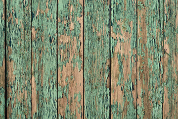 Obraz premium Close up of old weathered wooden planks with peeling paint. Natural rustic texture suitable for backgrounds and design layouts.