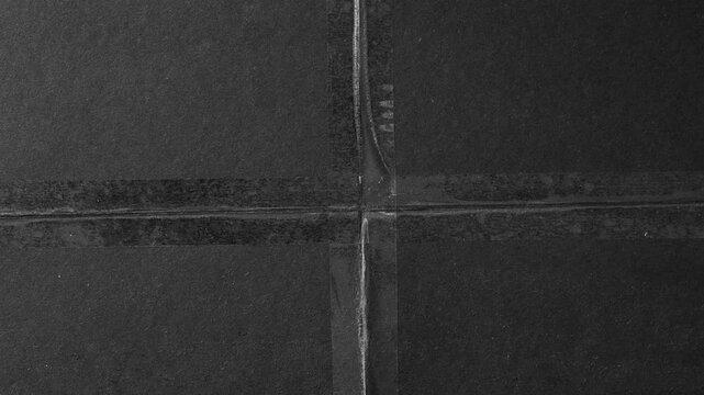 Minimalist black slate stone texture background, with geometric seams