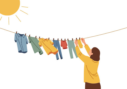 Woman Hanging Laundry on Clothesline Outdoors.